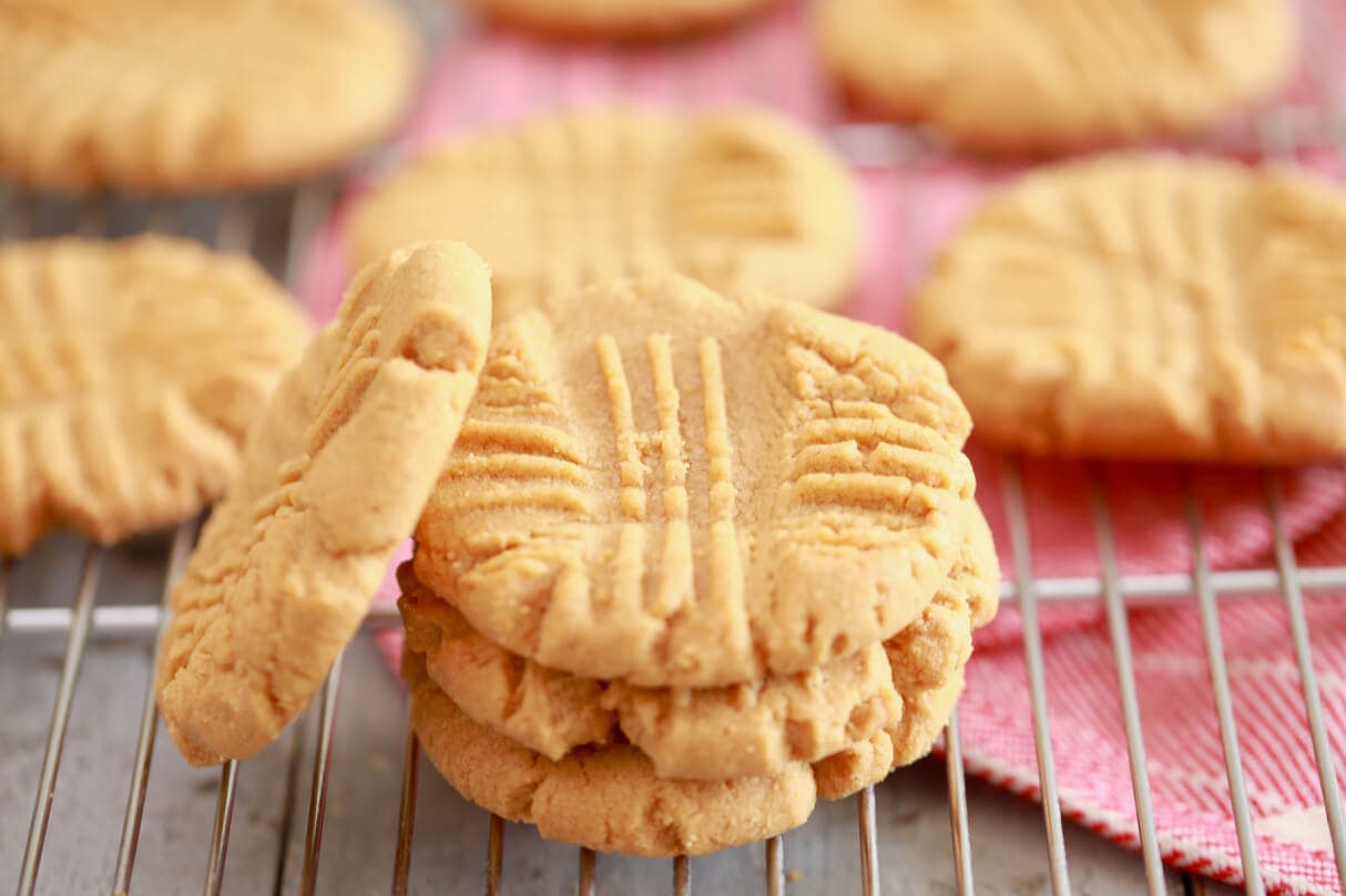 3 Ingredient Peanut Butter Cookies recipe stacked up on a wire rack.