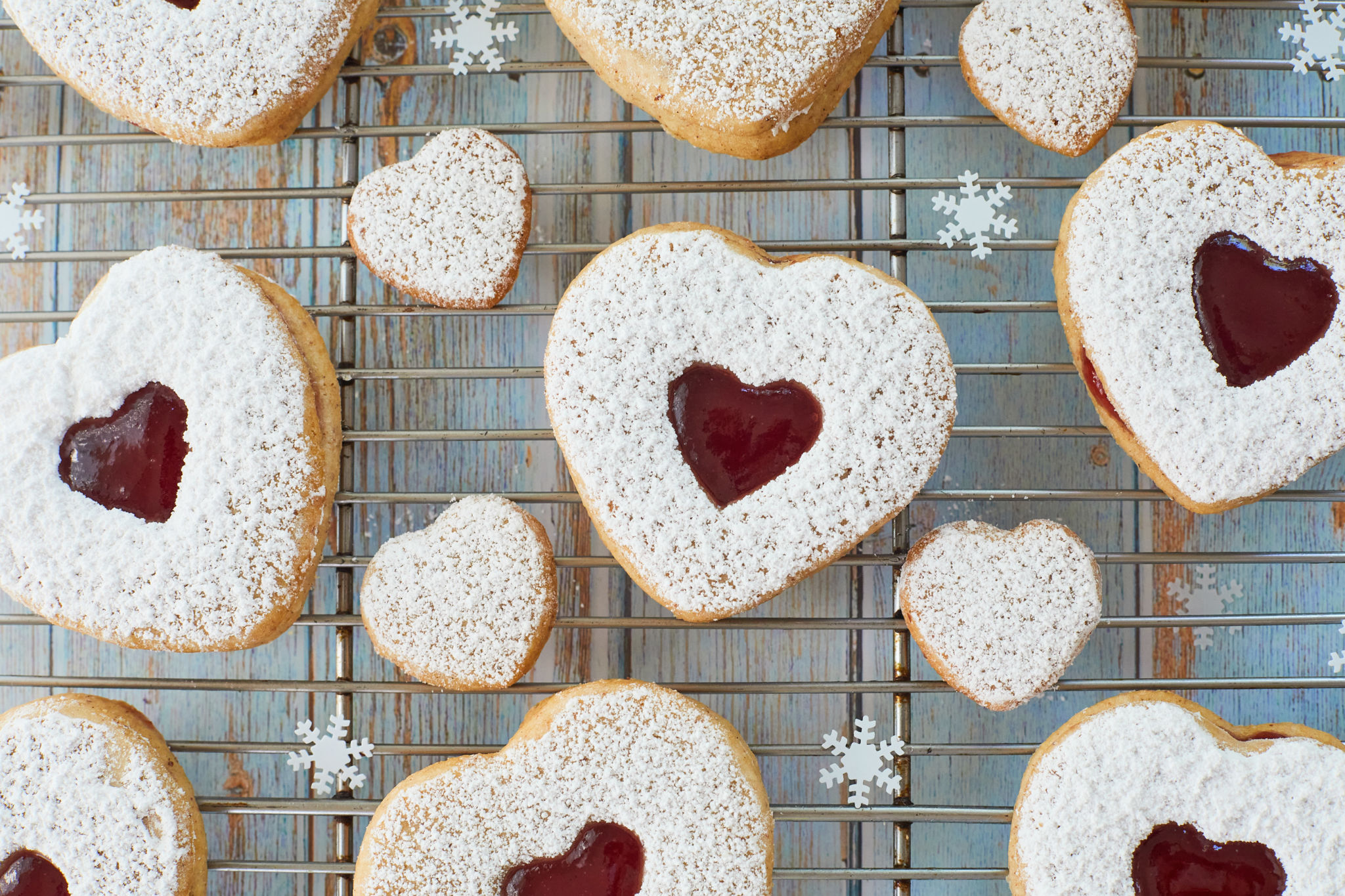 Top-down view of Linzer cookies with heart cutouts.
