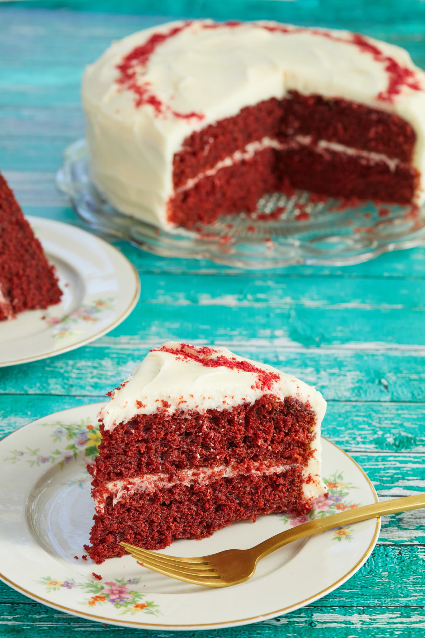 A slice of my moist Best-Ever Red Velvet Cake recipe, topped with ermine frosting.