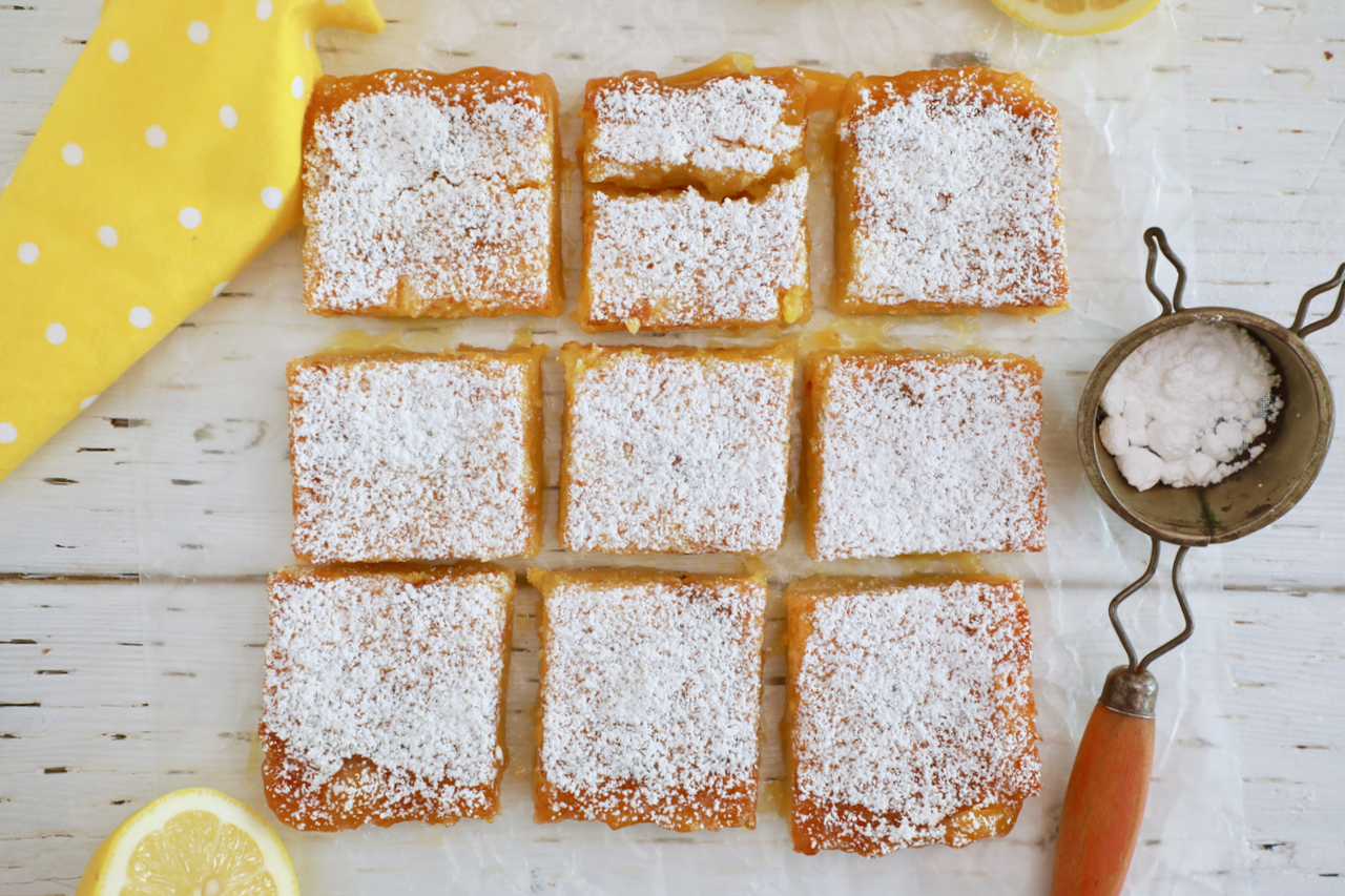 A grid of easy lemon bars dusted with powdered sugar made with my lemon bars recipe.